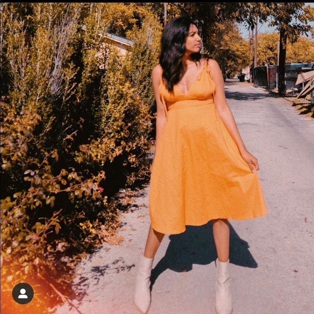 An Orange midi dress